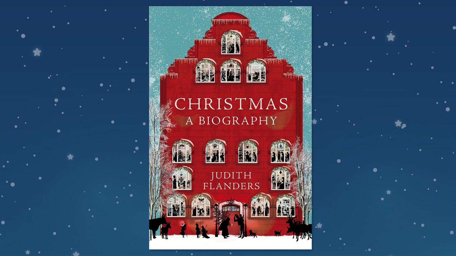 A jacket cover of a 'Christmas Biography' by Judith Flanders, depicting a red building with many windows and a snow scene in front of the house